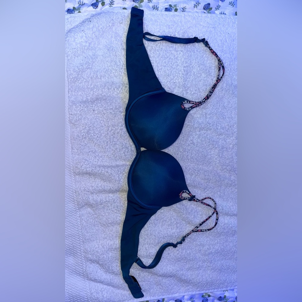 Soft, dark blue 32D Victorious Secret bra with pink/ silver straps.
